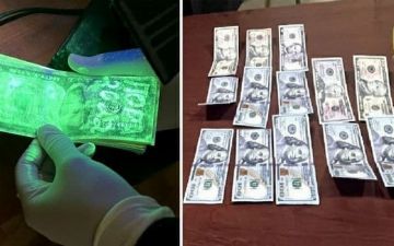 В Хорезме инспектора строительного надзора поймали на взятке $1000