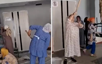 В Андижане директора школы уволили после видео с учителями, красящими стены